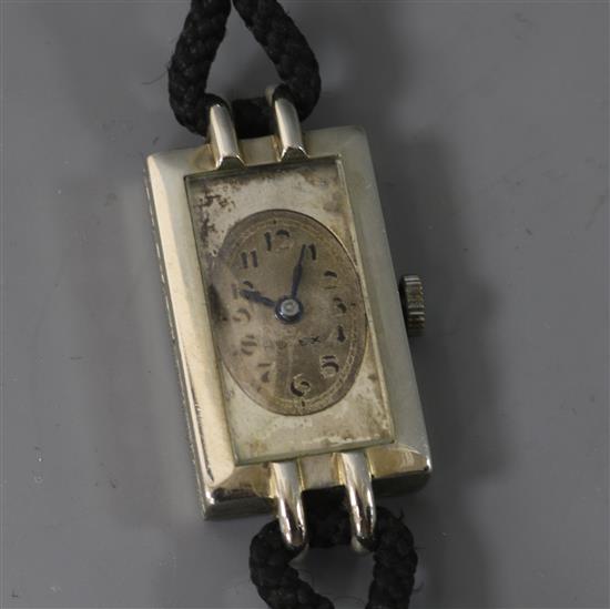 A ladys 18ct white gold Rolex rectangular dial manual wind wrist watch.